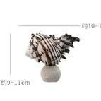 Black snail-travertine round bottom