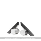 A pair of simple symbolic metal bookends